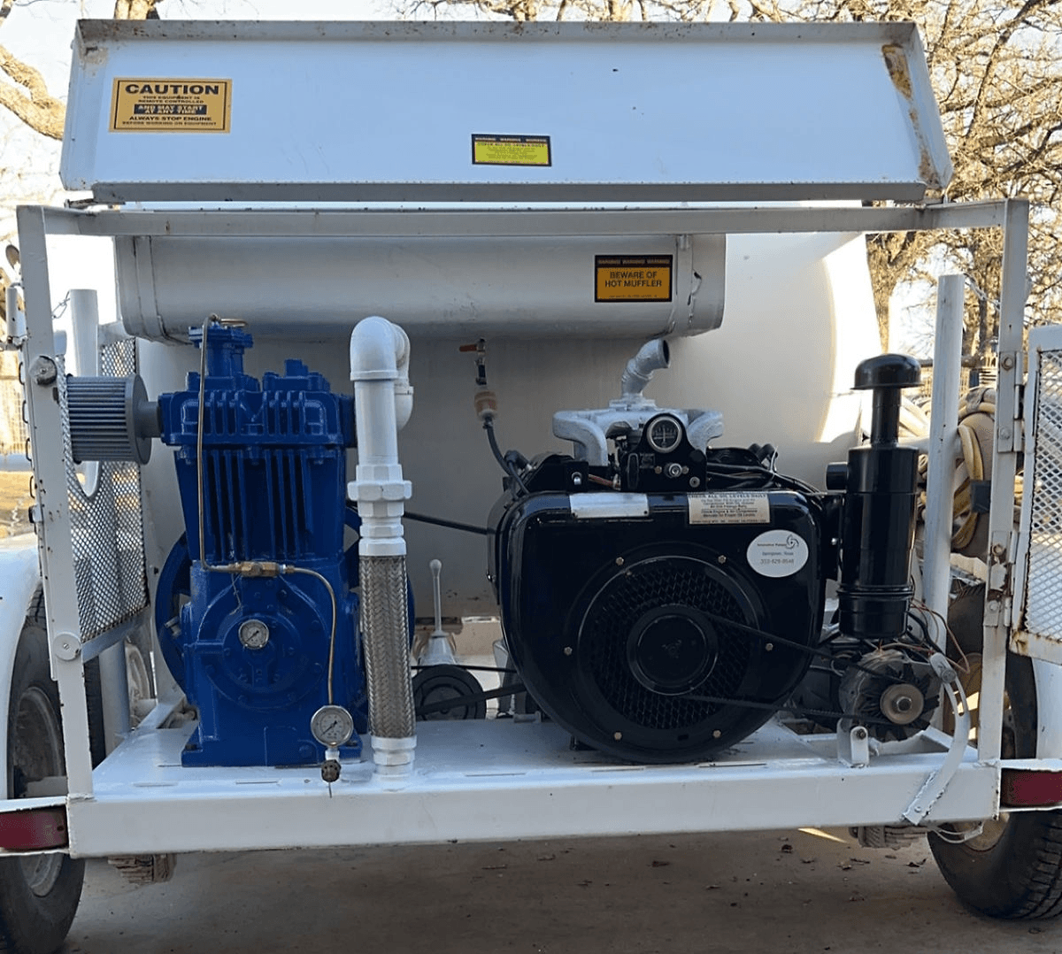 Custom mobile pump system with blue industrial pump and black engine mounted on trailer